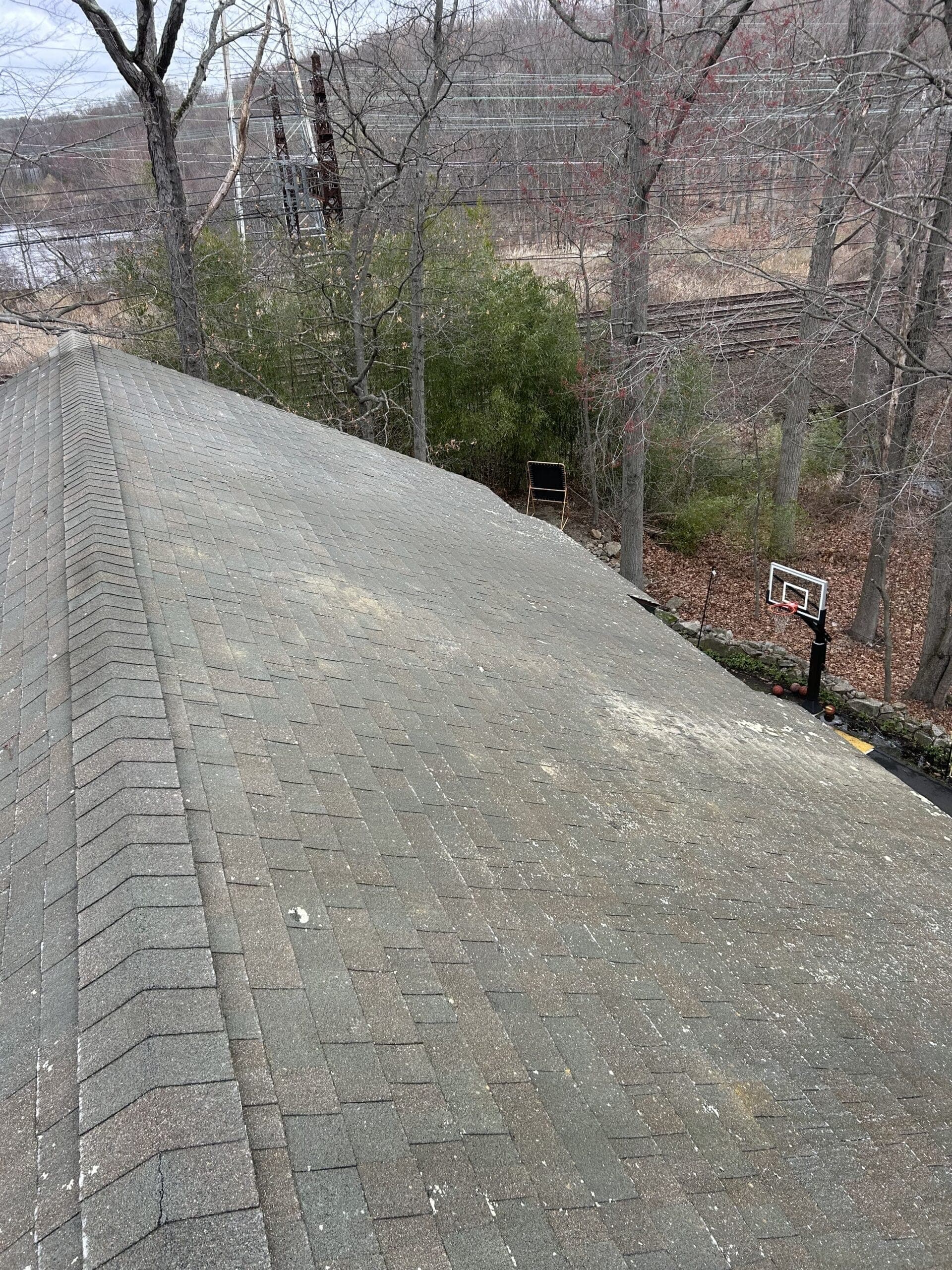 Asphalt roof shingles restored after soft washing — Fairfield County, CT